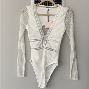 Never worn before white lace superdown body suit